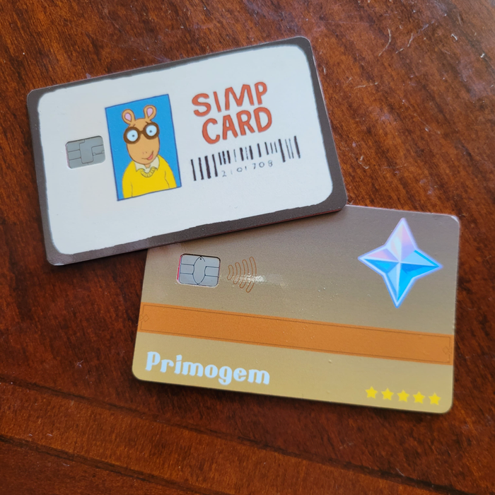 Customer showcasing their personalized simp primogem debit credit card skin